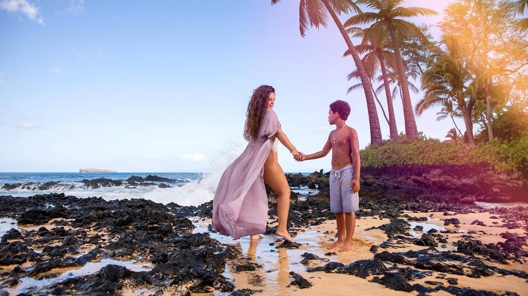 Interview with Lexi Eleni - Mother and son holding hands on the beach