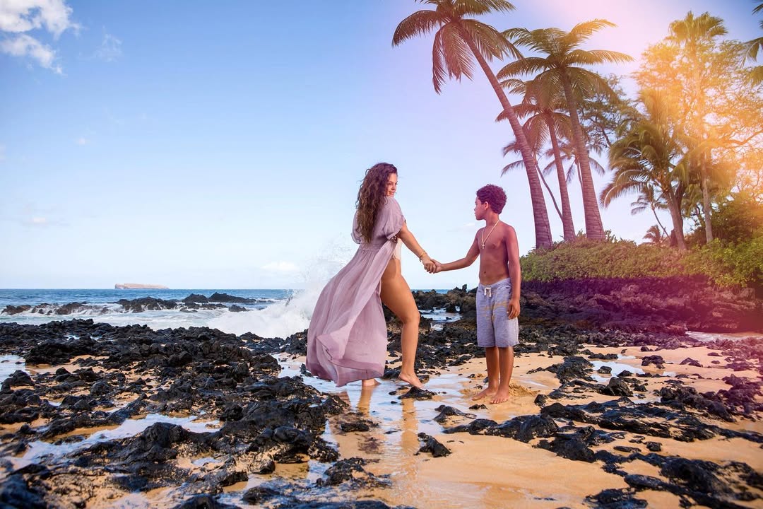 Interview with Lexi Eleni - Mother and son holding hands on the beach